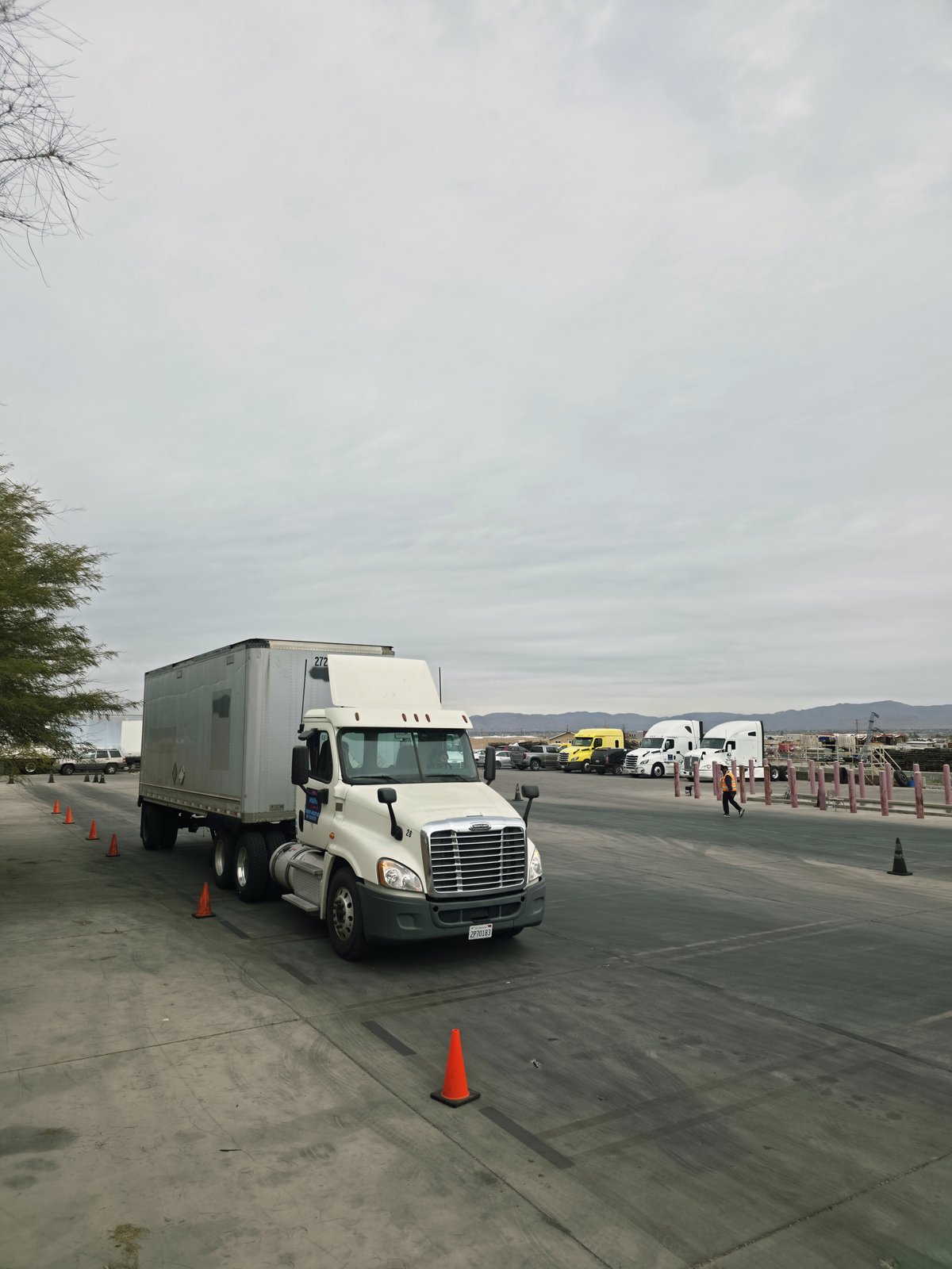 Truck Master CDL School training yard with cone maneuvers and fleet trucks